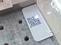 Nority Laser fiber marking machine to engrave QR codes on plastic surfaces.